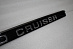 Планка Land Cruiser 100 над задним номером с надписью Land Cruiser , чёрная