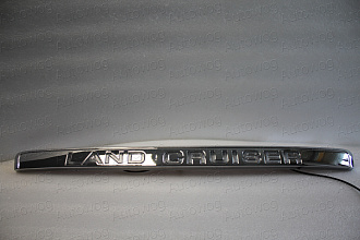 Планка Land Cruiser 100 над задним номером с надписью Land Cruiser , хром , с подсветкой