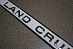 Планка Land Cruiser 100 над задним номером с надписью Land Cruiser , белая ( 056 )